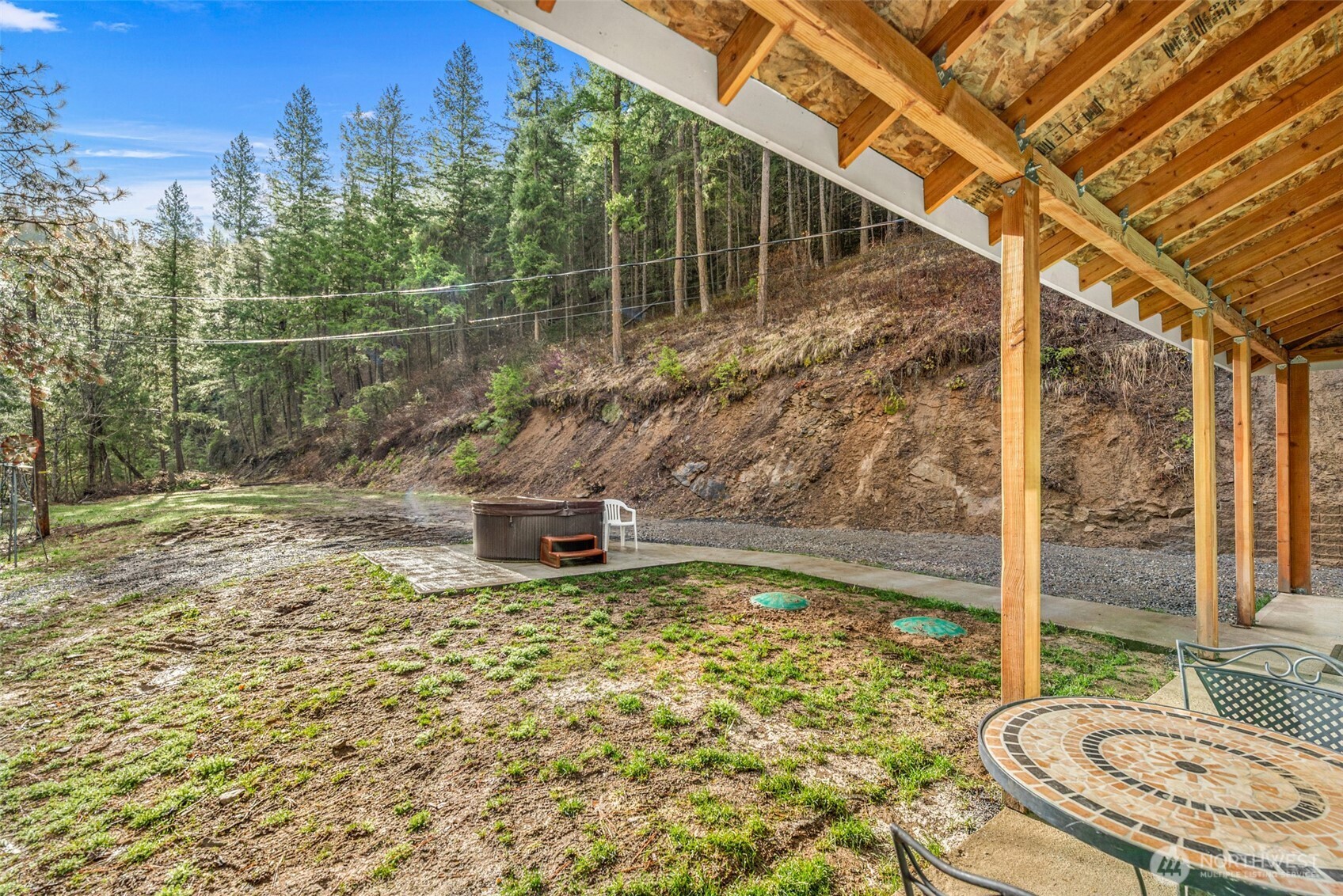 695 Sand Creek Road Cashmere, WA 98815 - Photo 7 of 40 a view of a chairs and table in the patio