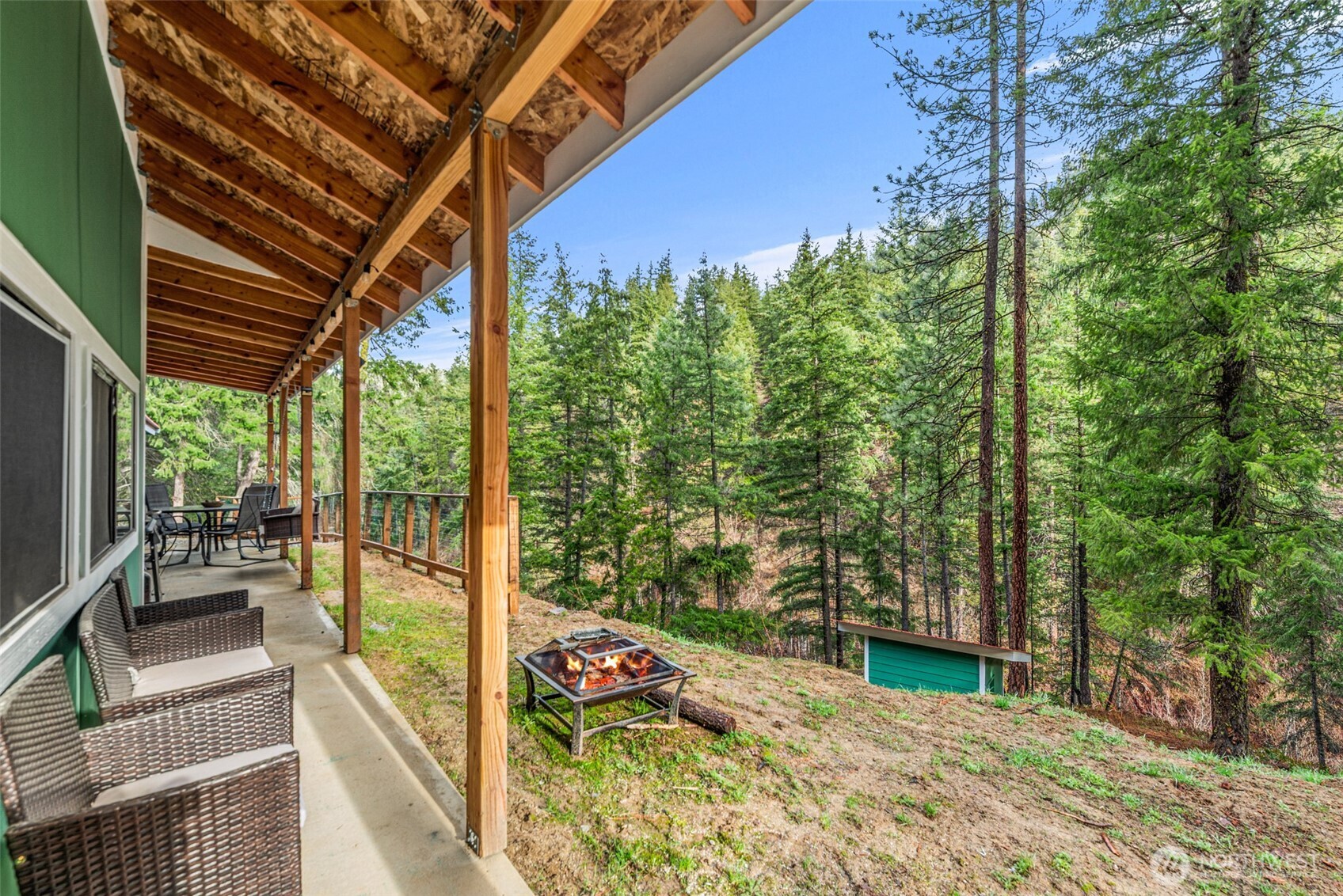 695 Sand Creek Road Cashmere, WA 98815 - Photo 9 of 40 a view of a balcony with chairs