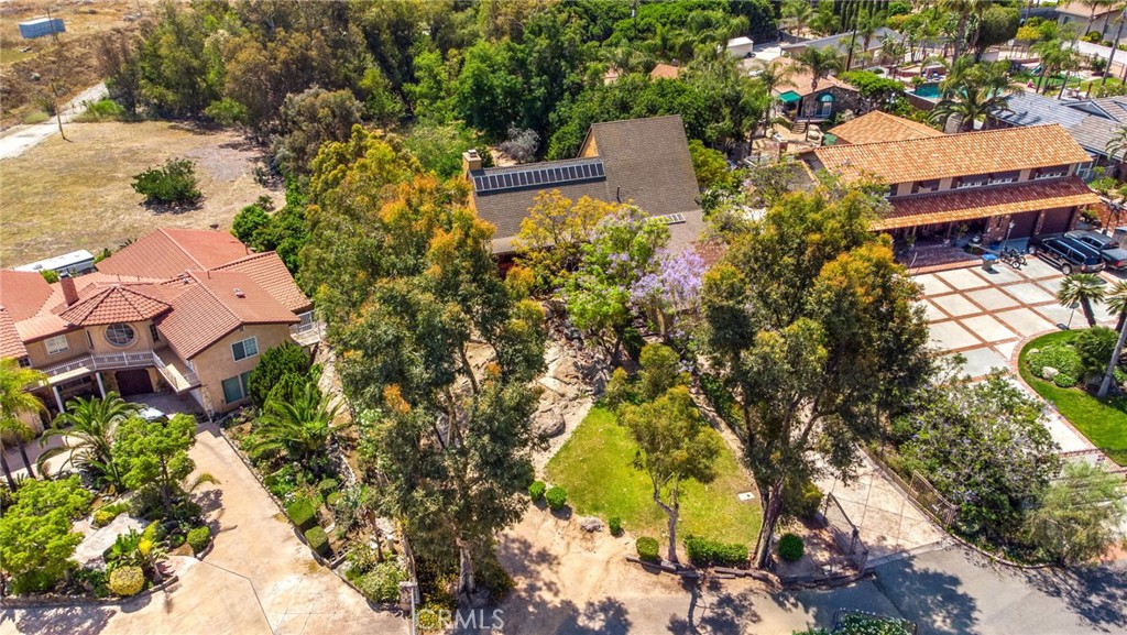 7241 Old Temescal Road Corona, CA 92881 - Photo 42 of 47 an aerial view of a house with a yard and large trees