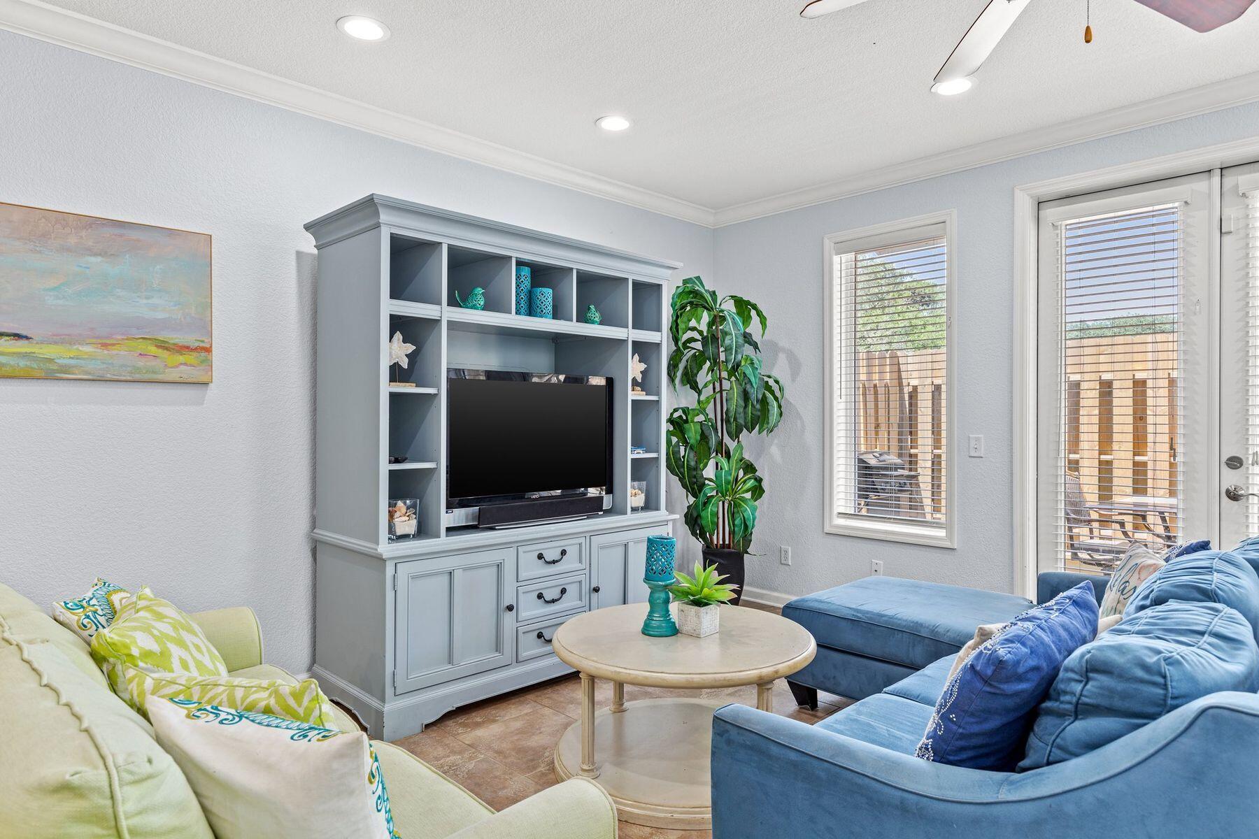 156 Southfields Road Panama City Beach, FL 32413 - Photo 13 of 35 a living room with furniture and a flat screen tv
