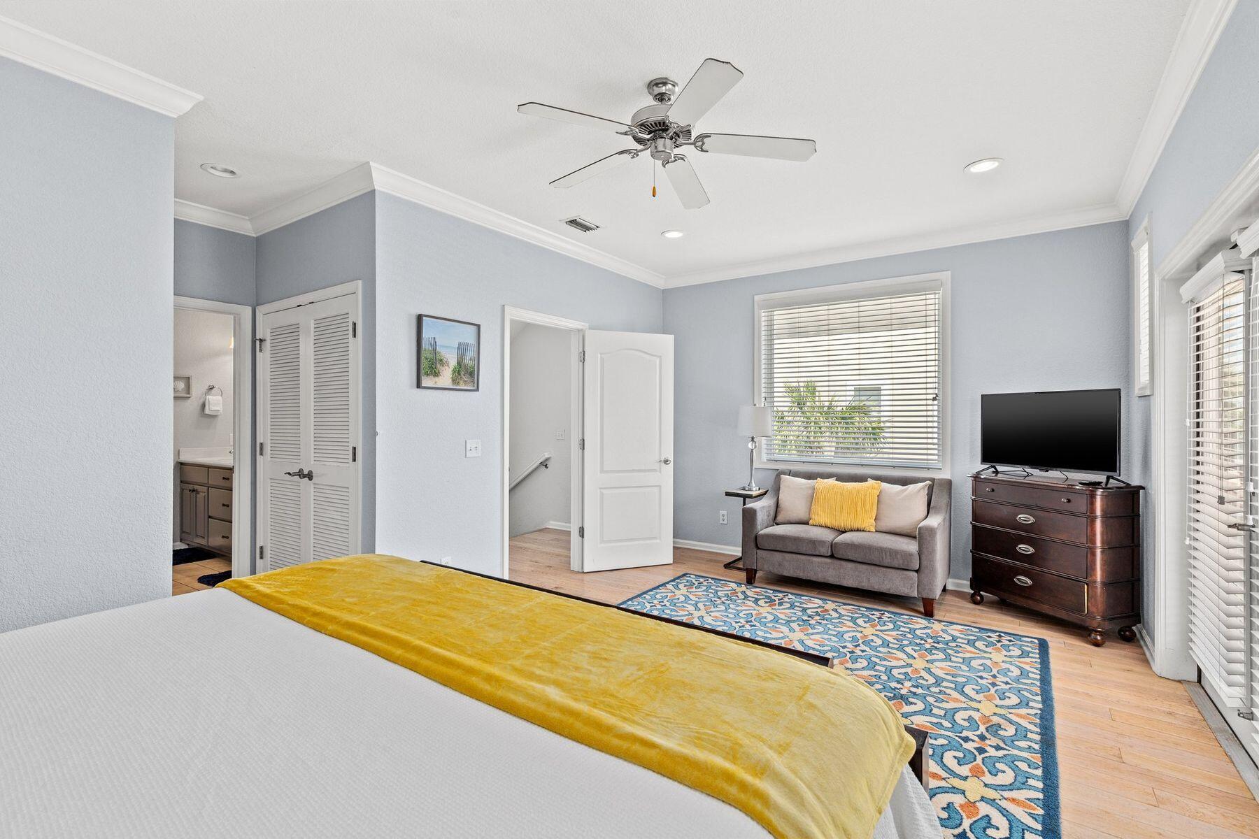 156 Southfields Road Panama City Beach, FL 32413 - Photo 16 of 35 a bedroom with a bed and a flat screen tv