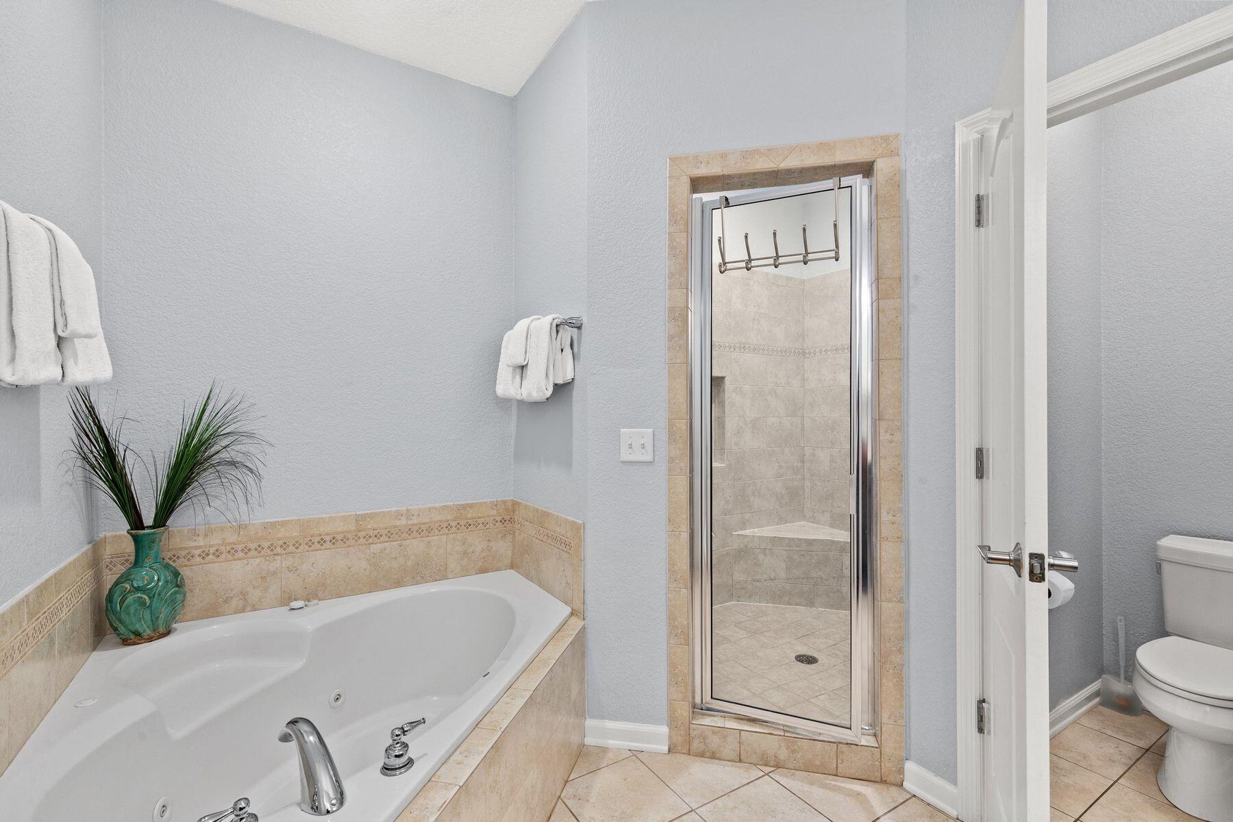 156 Southfields Road Panama City Beach, FL 32413 - Photo 18 of 35 a bathroom with a bathtub and a shower