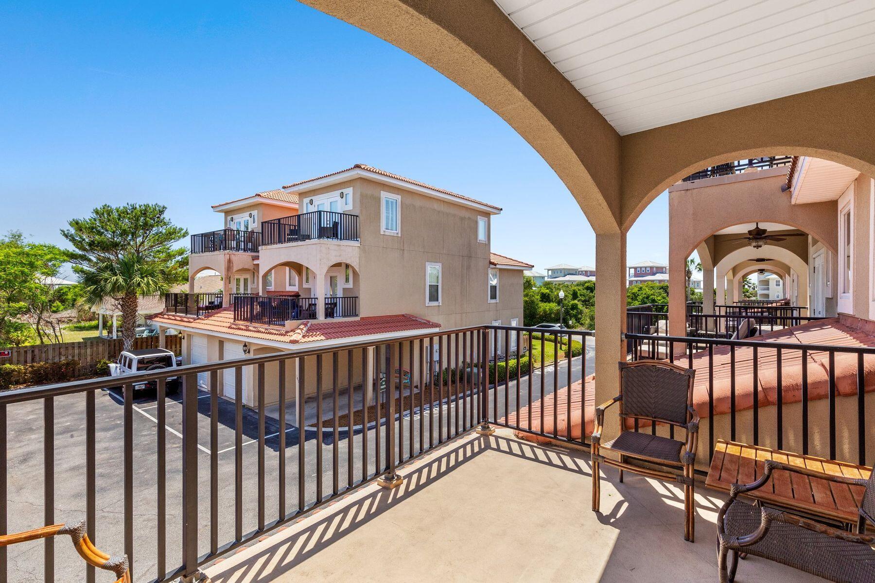 156 Southfields Road Panama City Beach, FL 32413 - Photo 29 of 35 a view of a balcony with a swing