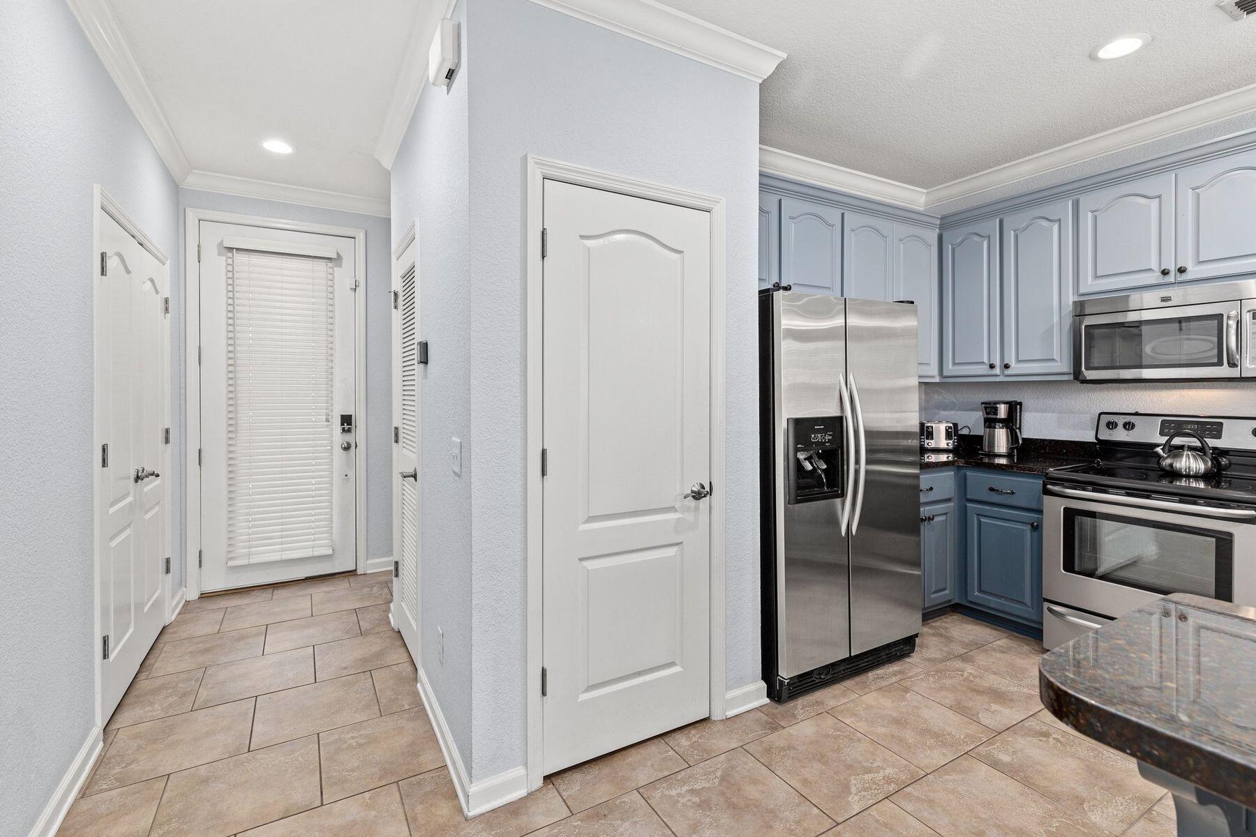 156 Southfields Road Panama City Beach, FL 32413 - Photo 7 of 35 a kitchen with stainless steel appliances granite countertop a refrigerator and a stove top oven