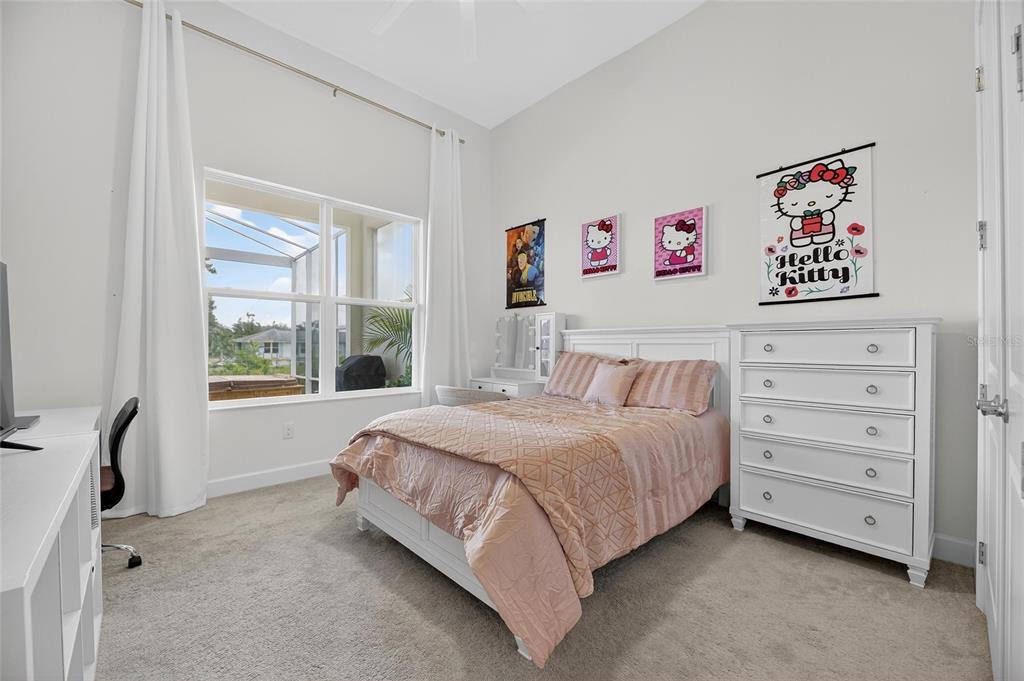 5975 Blakeney Loop Apollo Beach, FL 33572 - Photo 33 of 100 a bedroom with a bed and a window
