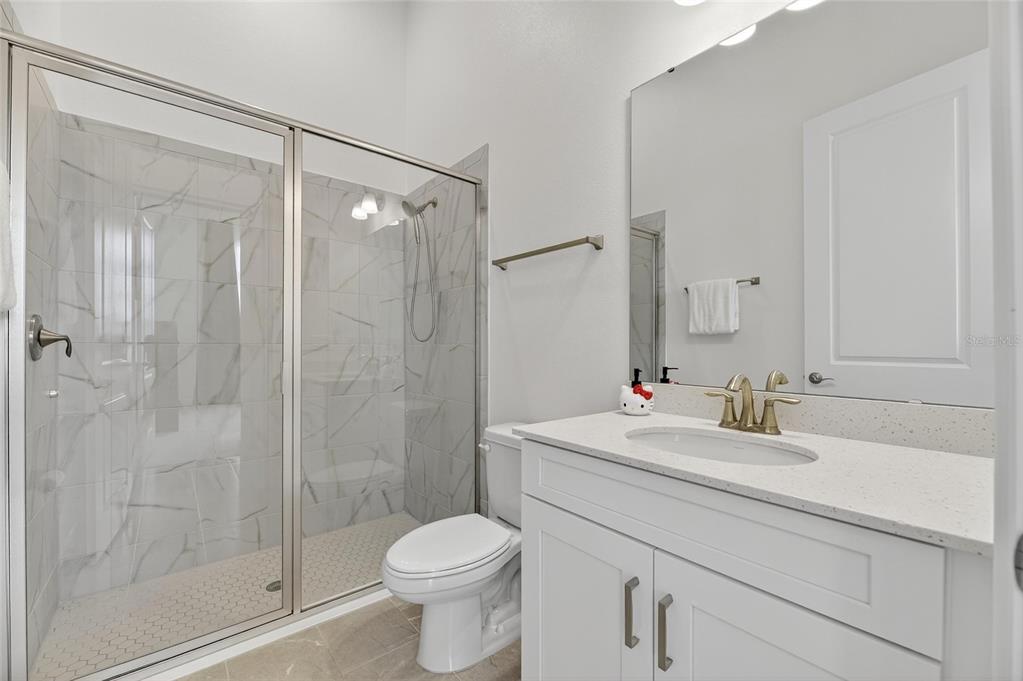 5975 Blakeney Loop Apollo Beach, FL 33572 - Photo 40 of 100 a bathroom with a sink toilet and shower