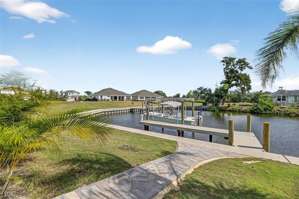 5975 Blakeney Loop Apollo Beach, FL 33572 - Photo 4 of 100 a view of a swimming pool with a lake view