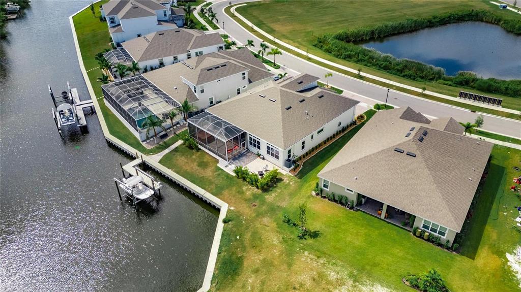 5975 Blakeney Loop Apollo Beach, FL 33572 - Photo 4 of 100 an aerial view of a house with swimming pool and outdoor seating