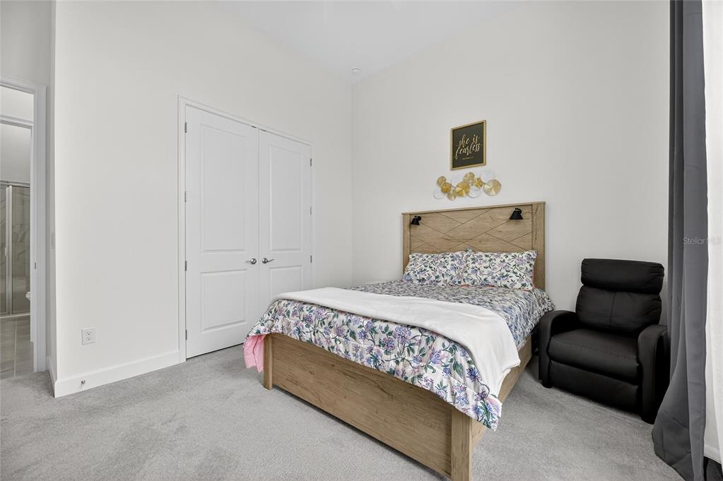 5975 Blakeney Loop Apollo Beach, FL 33572 - Photo 42 of 100 a bedroom with a bed and a couch