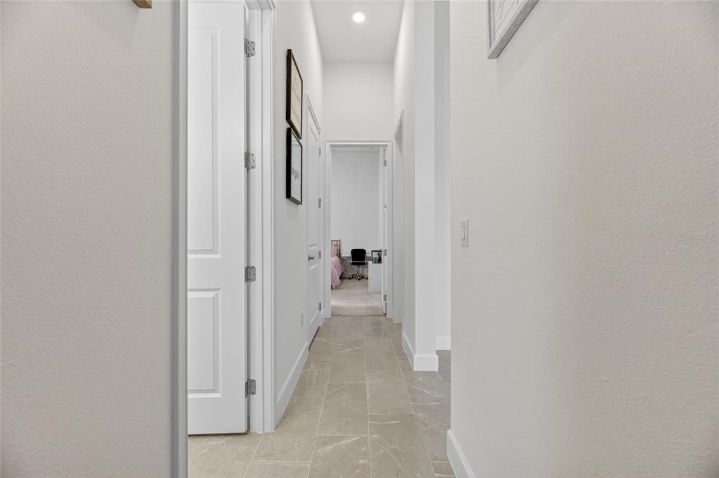 5975 Blakeney Loop Apollo Beach, FL 33572 - Photo 47 of 100 a view of a hallway with white walls
