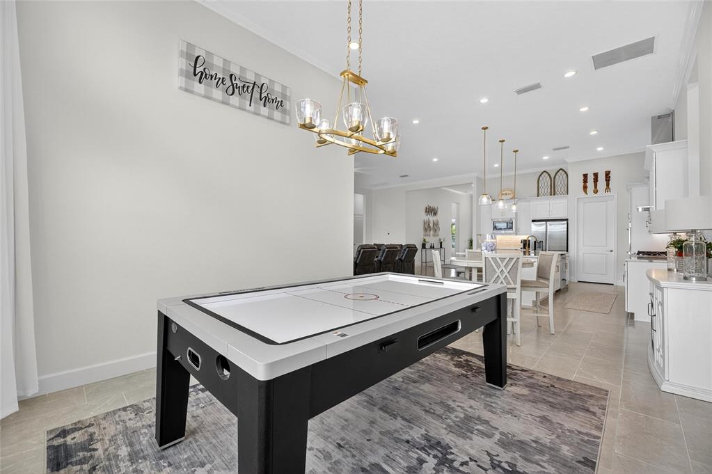 5975 Blakeney Loop Apollo Beach, FL 33572 - Photo 50 of 100 a room with furniture and a table