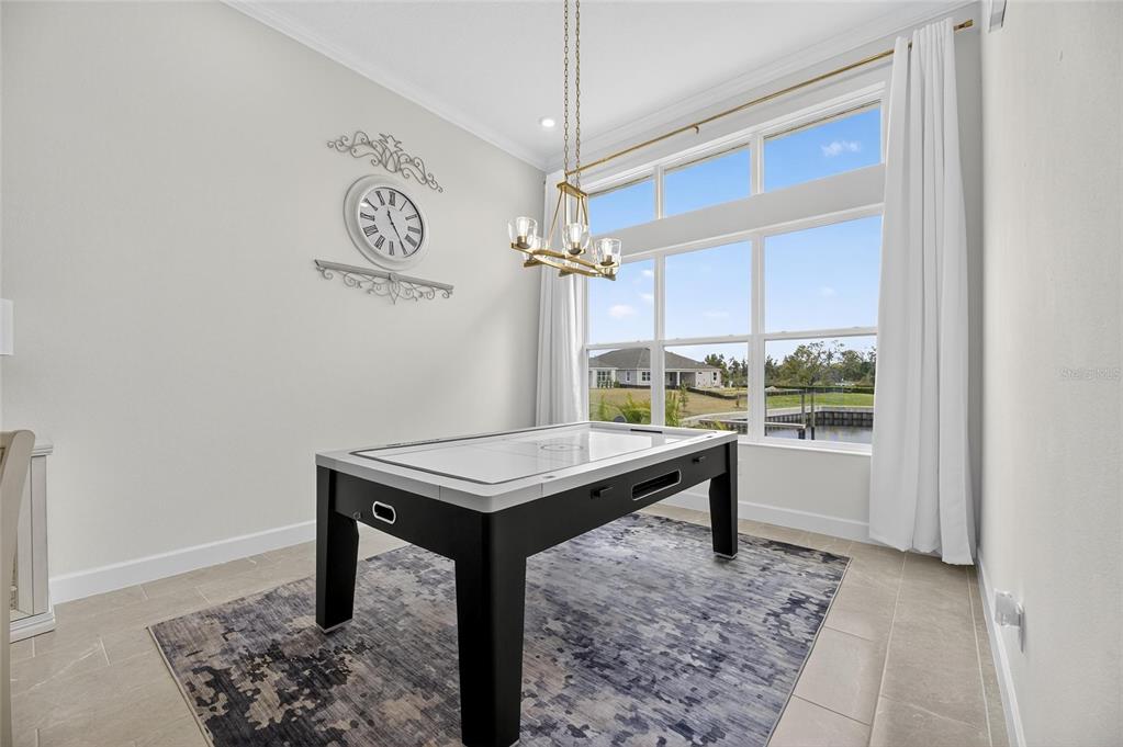 5975 Blakeney Loop Apollo Beach, FL 33572 - Photo 50 of 100 a view of a room with a table and chairs