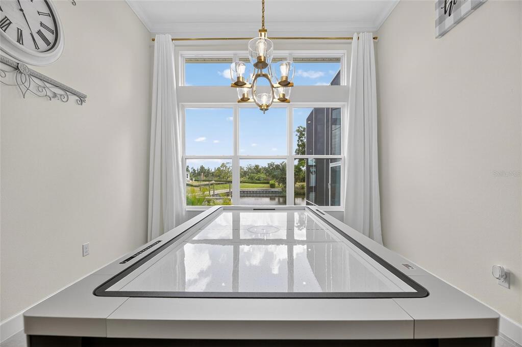 5975 Blakeney Loop Apollo Beach, FL 33572 - Photo 52 of 100 a view of dining room with a chandelier