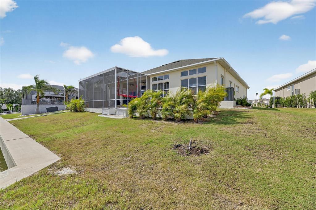 5975 Blakeney Loop Apollo Beach, FL 33572 - Photo 64 of 100 a front view of a house with garden