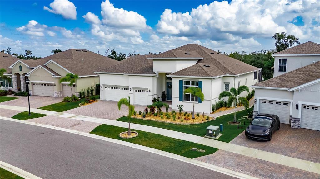 5975 Blakeney Loop Apollo Beach, FL 33572 - Photo 76 of 100 front view of house with a garden