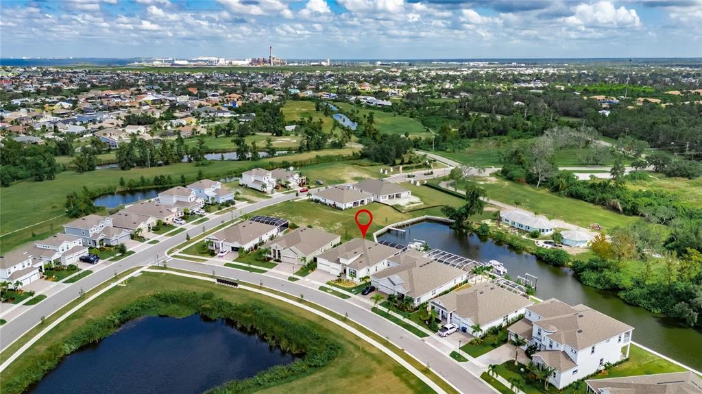 5975 Blakeney Loop Apollo Beach, FL 33572 - Photo 78 of 100 an aerial view of a residential houses with outdoor space and street view