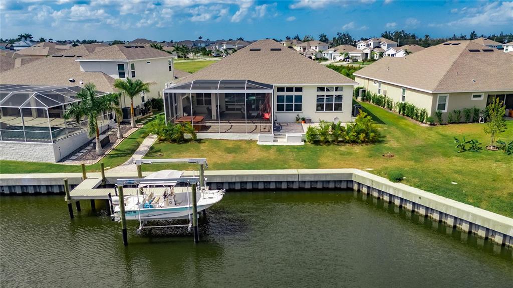 5975 Blakeney Loop Apollo Beach, FL 33572 - Photo 78 of 100 an aerial view of a house with swimming pool and lake view