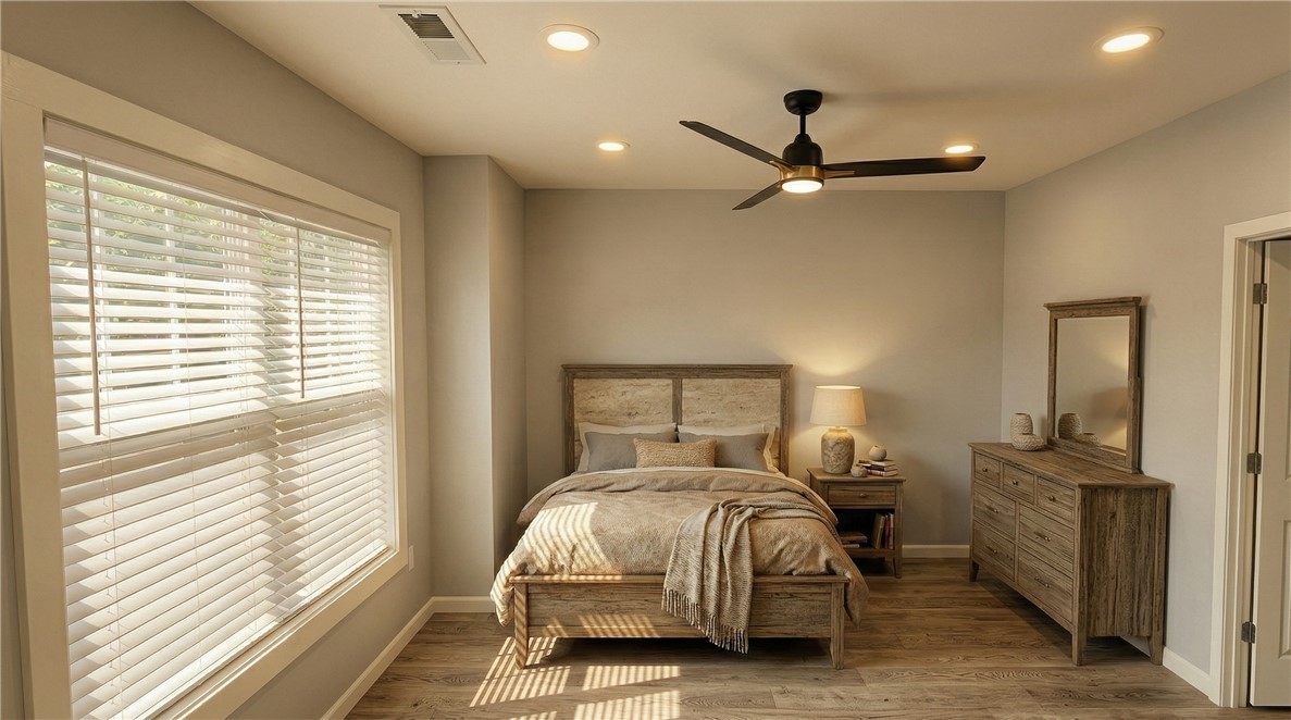 102 Kelly Road Clemson, SC 29631 - Photo 13 of 18 Organic Textural Package. This tranquil bedroom features recessed lighting and warm wood flooring, offering a peaceful retreat.