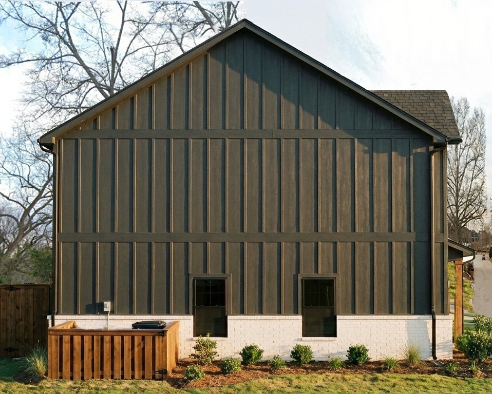 102 Kelly Road Clemson, SC 29631 - Photo 3 of 18 This home features a striking dark facade with white brick detailing.