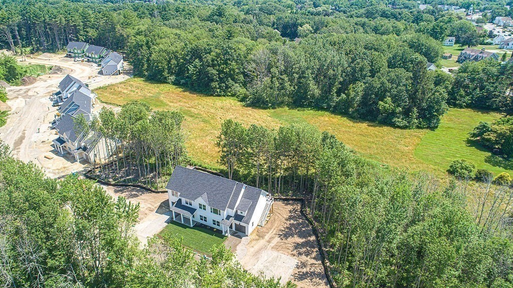 16 Meadowview Lane, Unit B Salisbury, MA 01952 - Photo 18 of 23 a view of a yard with an outdoor seating and trees