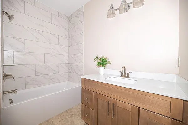 a bathroom with a sink and a bathtub
