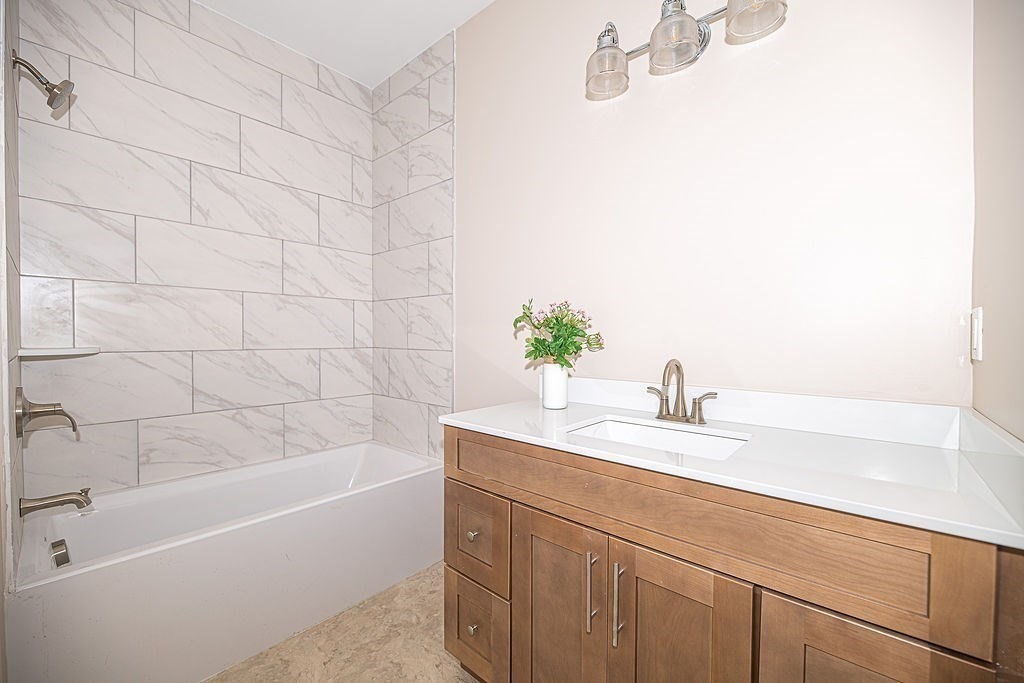 16 Meadowview Lane, Unit B Salisbury, MA 01952 - Photo 7 of 23 a bathroom with a sink and a bathtub