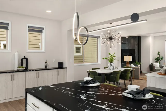 a kitchen with stainless steel appliances granite countertop a stove and a sink
