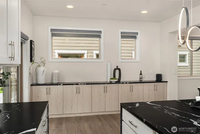 a bathroom with a toilet a sink and a mirror