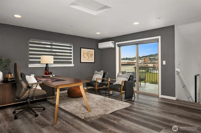 a living room with furniture and a rug