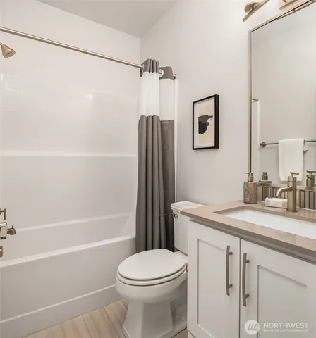 a bathroom with a shower and a bath tub