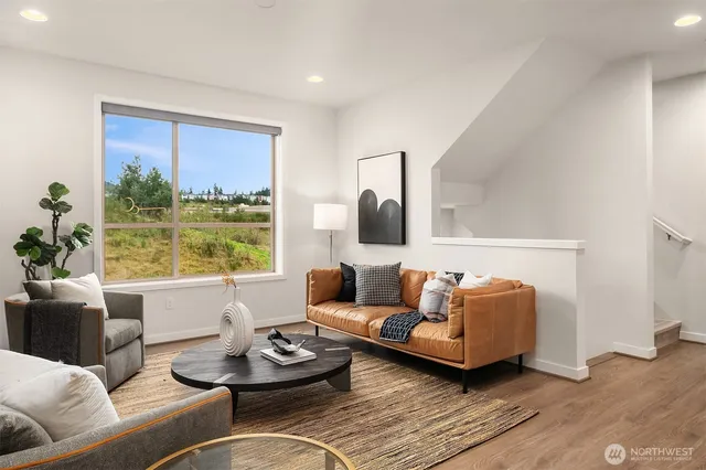 a living room with furniture and city view