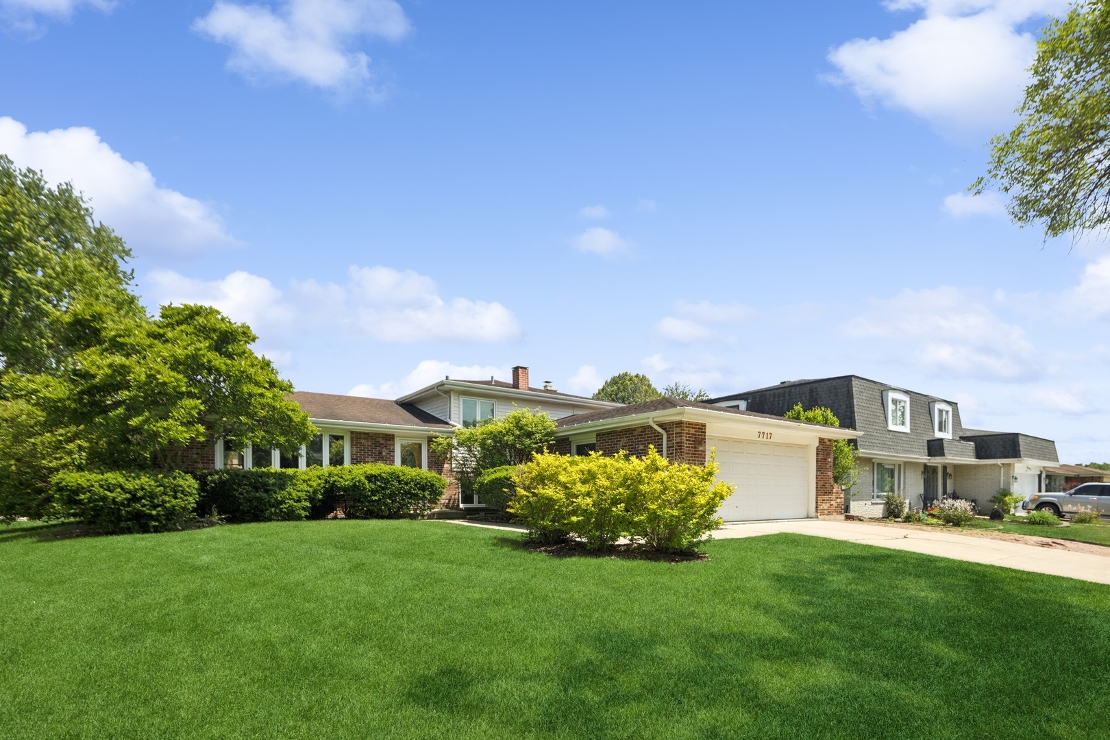 7717 Sawyer Road Darien, IL 60561 - Photo 1 of 15 a view of a garden with a house