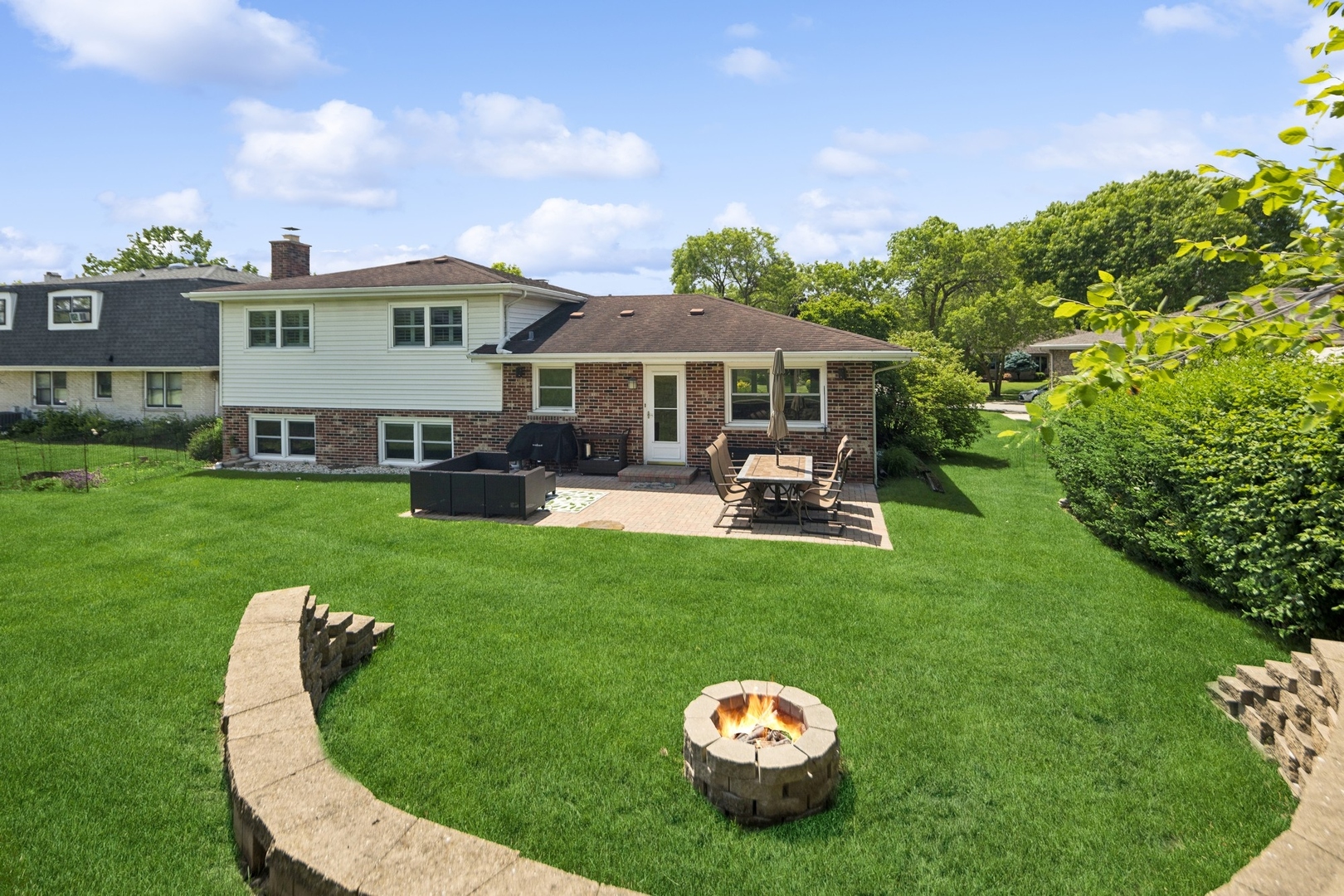 7717 Sawyer Road Darien, IL 60561 - Photo 14 of 15 a view of a house with a backyard and swimming pool
