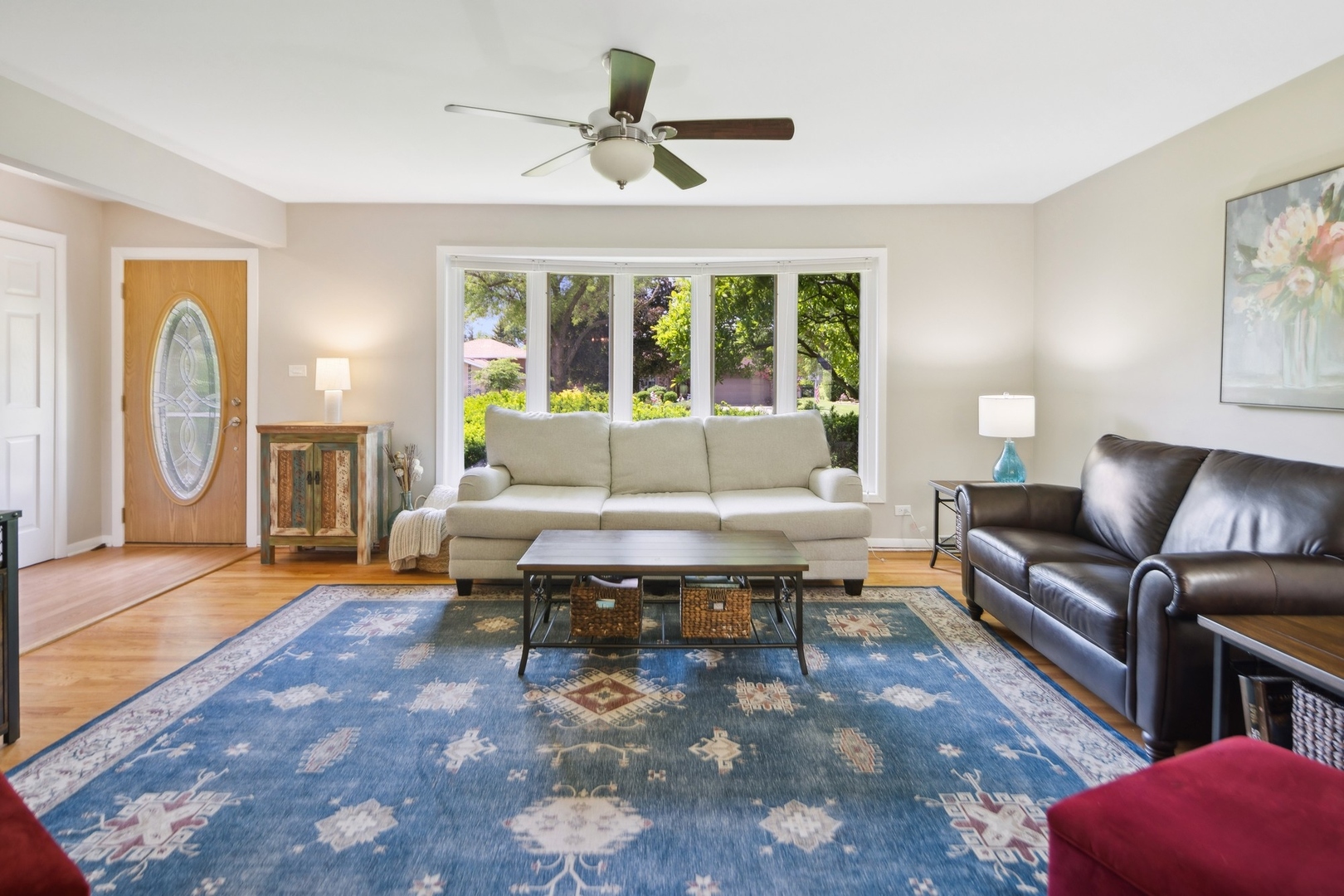7717 Sawyer Road Darien, IL 60561 - Photo 2 of 15 a living room with furniture and a large window
