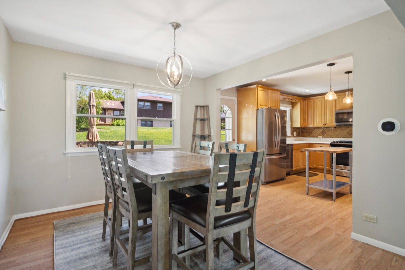7717 Sawyer Road Darien, IL 60561 - Photo 4 of 15 a view of a dining room with furniture window and wooden floor
