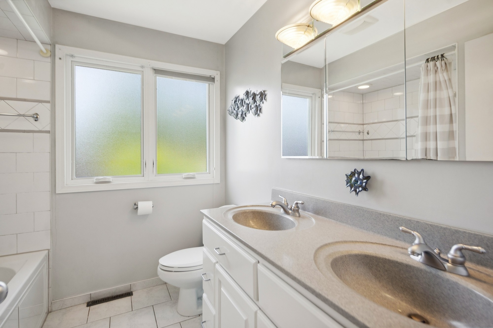7717 Sawyer Road Darien, IL 60561 - Photo 10 of 15 a bathroom with a sink toilet and shower