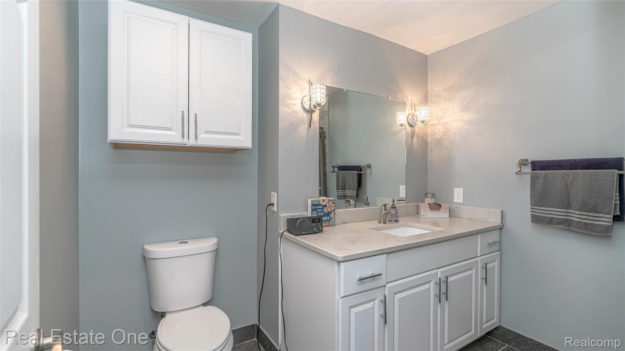 5997 Coppersmith Road Waterford, MI 48327 - Photo 23 of 45 En-suite private bathroom features marble vanity and satin nickel faucets and fixtures