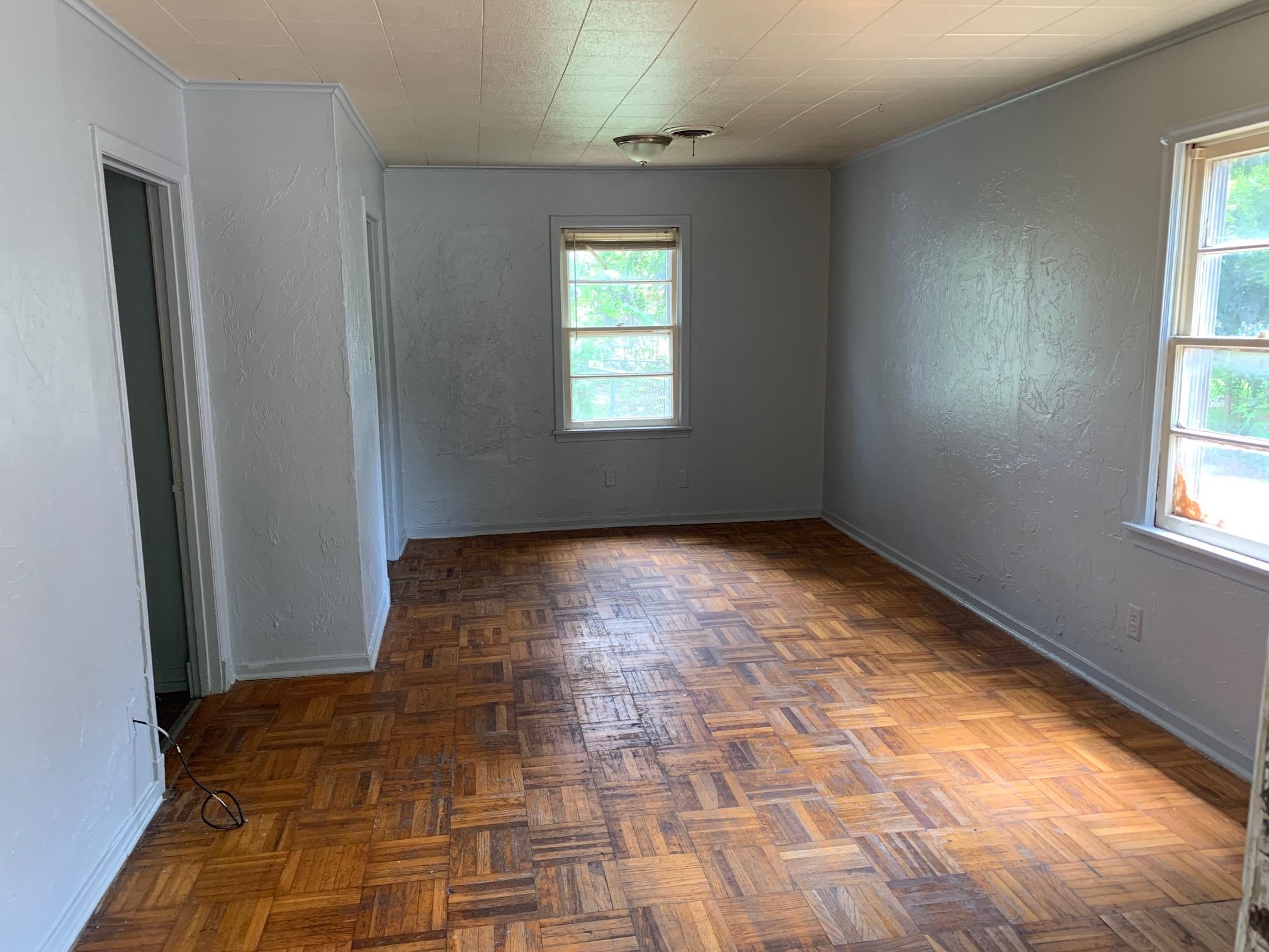 1610 Ozan Street Memphis, TN 38108 - Photo 2 of 9 a view of empty room with windows