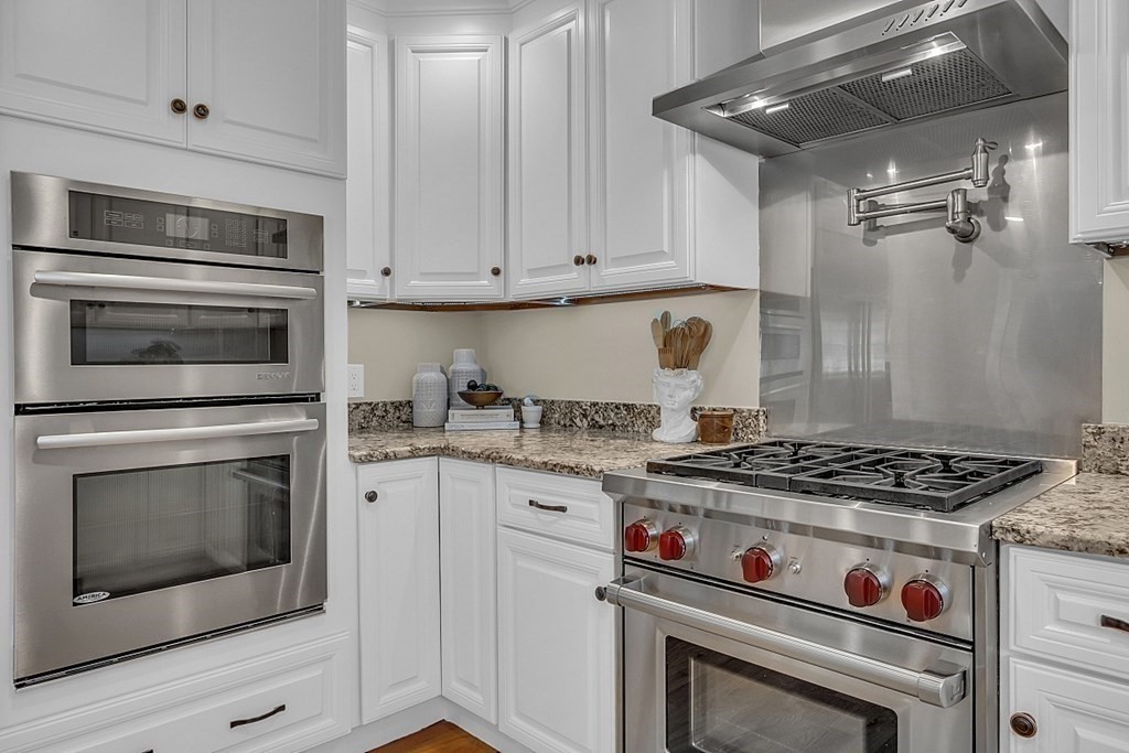 35 Pinewood Road Wellesley, MA 02482 - Photo 12 of 39 a stove top oven sitting inside of a kitchen