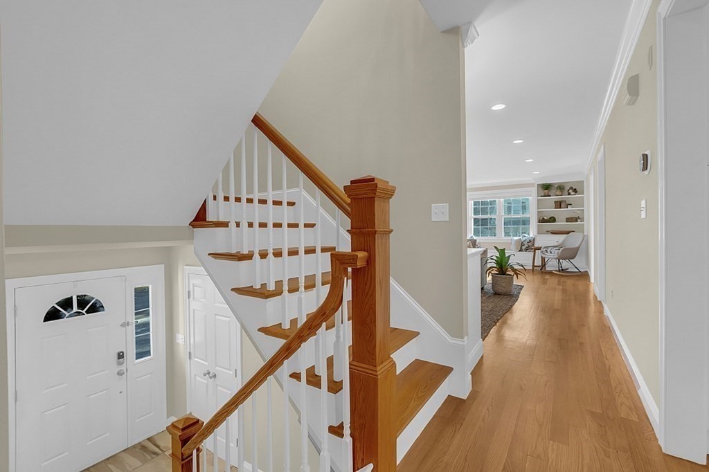 35 Pinewood Road Wellesley, MA 02482 - Photo 20 of 39 a view of a hallway with the wooden floor and stairs