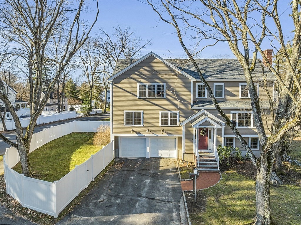 35 Pinewood Road Wellesley, MA 02482 - Photo 2 of 39 front view of a house with a yard