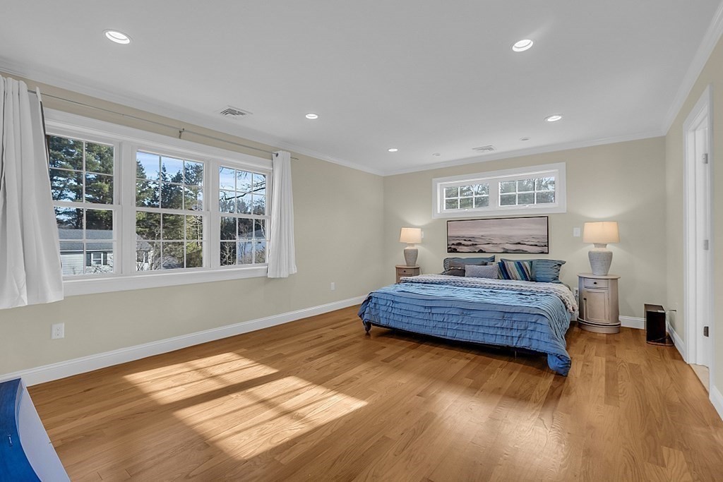 35 Pinewood Road Wellesley, MA 02482 - Photo 22 of 39 a spacious bedroom with a bed and wooden floor