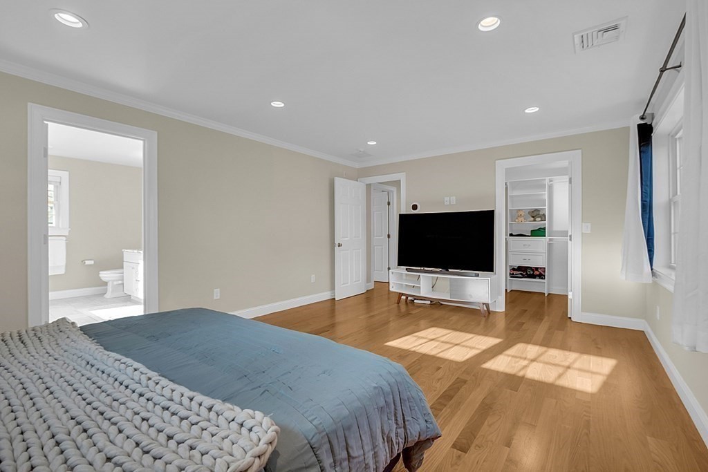 35 Pinewood Road Wellesley, MA 02482 - Photo 23 of 39 a bedroom with a bed and a flat screen tv