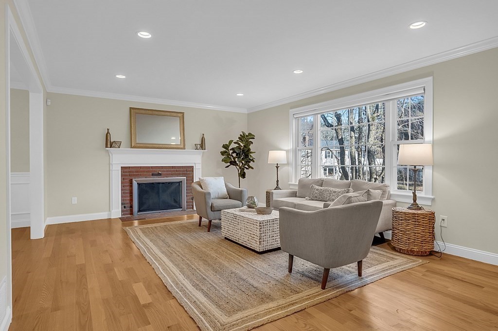 35 Pinewood Road Wellesley, MA 02482 - Photo 3 of 39 a living room with furniture a fireplace and a potted plant