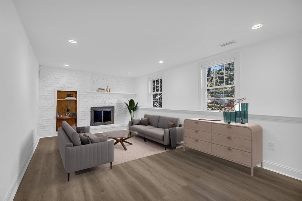 35 Pinewood Road Wellesley, MA 02482 - Photo 33 of 39 a living room with furniture and a fireplace