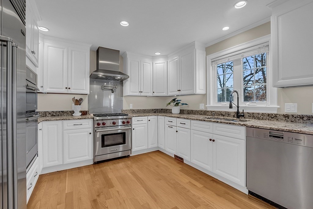 35 Pinewood Road Wellesley, MA 02482 - Photo 10 of 39 a kitchen with stainless steel appliances granite countertop a stove sink and cabinets
