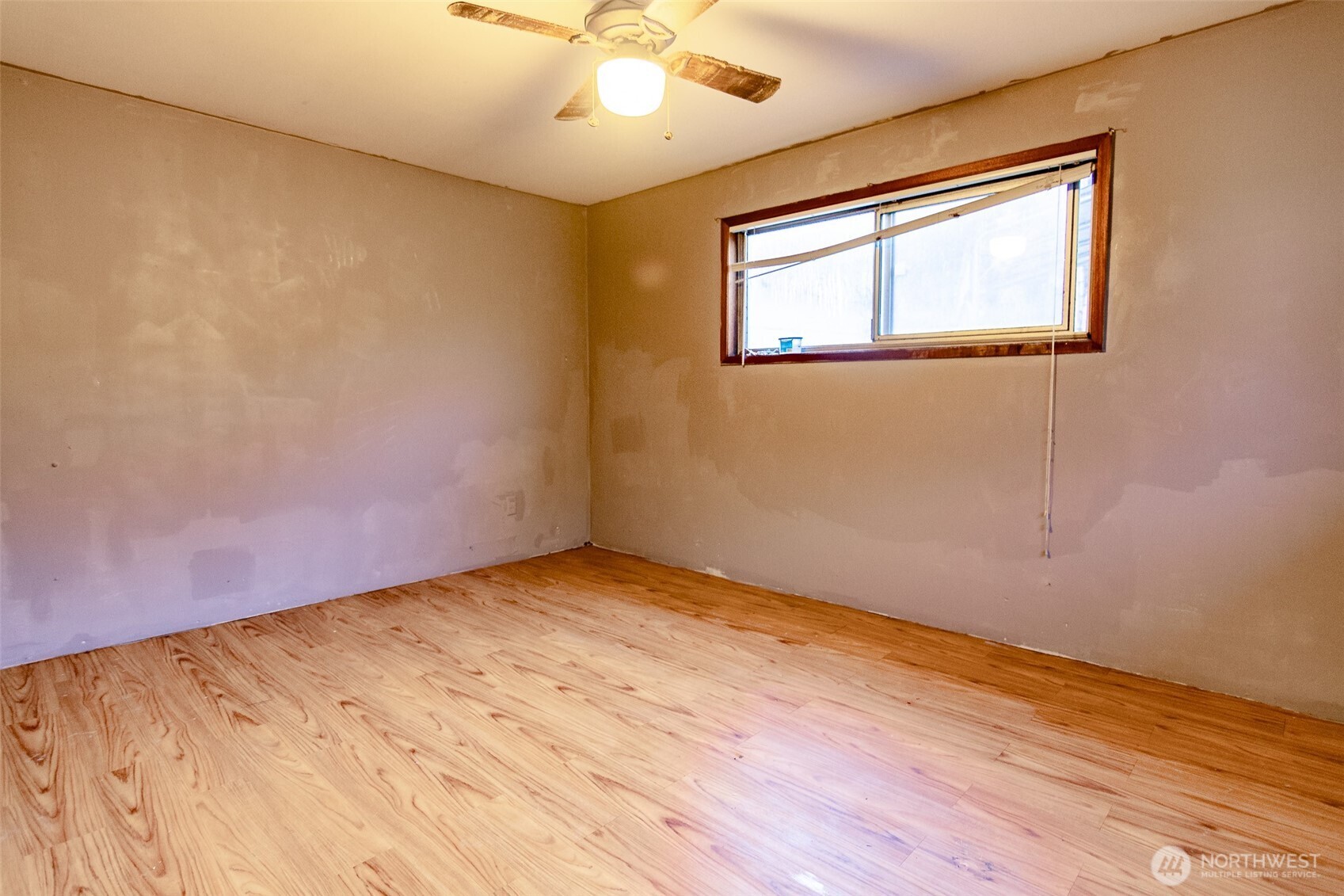 22731 Hull Road Mount Vernon, WA 98274 - Photo 12 of 26 a view of an empty room with wooden floor and a window