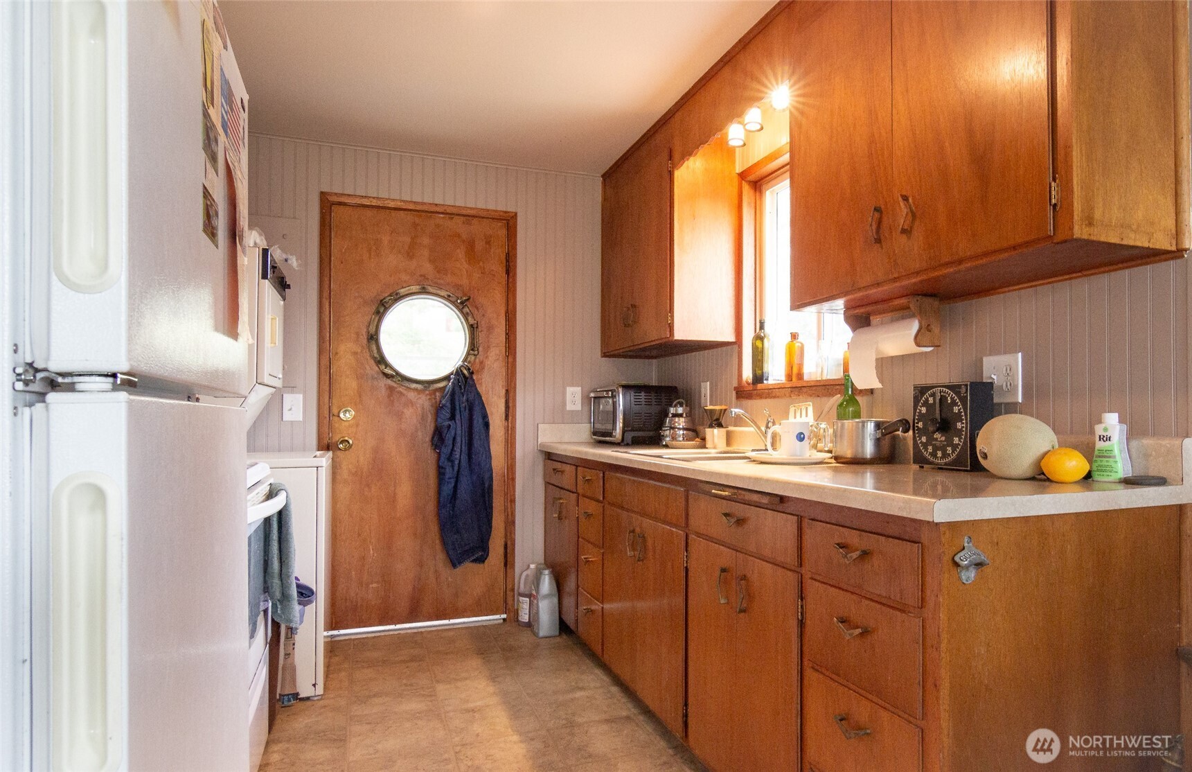 22731 Hull Road Mount Vernon, WA 98274 - Photo 20 of 26 a kitchen with refrigerator and window