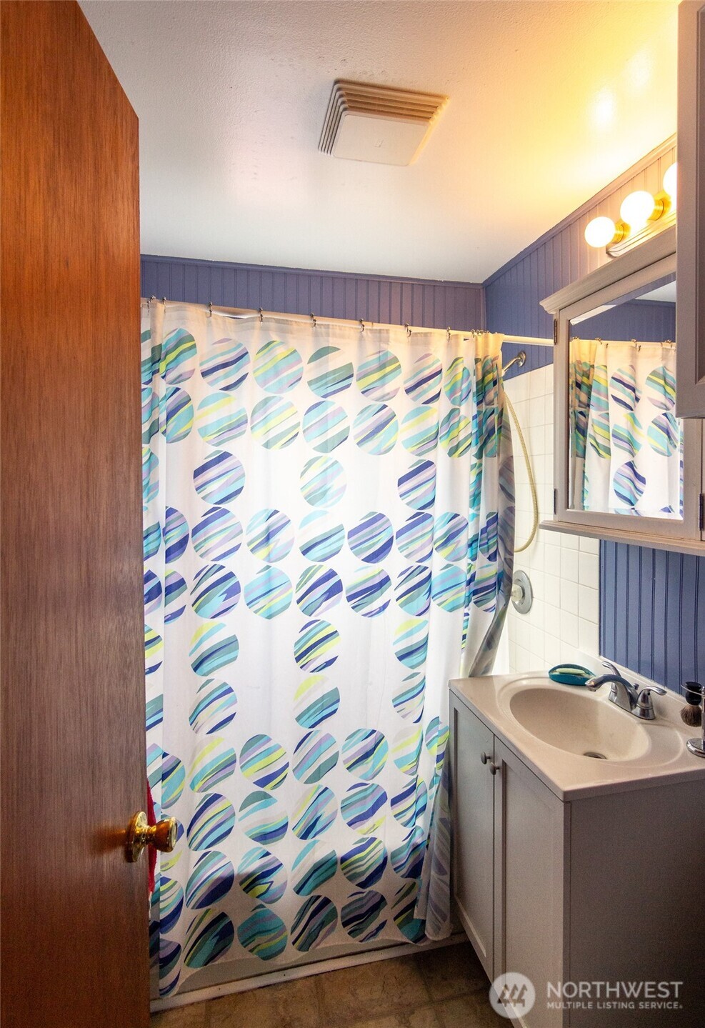 22731 Hull Road Mount Vernon, WA 98274 - Photo 25 of 26 a bathroom with a sink and a mirror