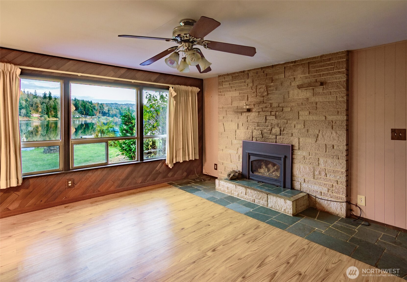 22731 Hull Road Mount Vernon, WA 98274 - Photo 4 of 26 a view of an empty room with a fireplace and a window